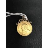 Gold Jewellery: South African gold pendant coin dated 1894 with 9ct gold scrolls (added later).