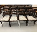 19th cent. Rosewood sabre leg dining chairs with drop in seats. (4)