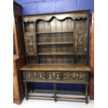 1930s, 17th cent. style, oak dresser with geometric mouldings and brass pear drop handles on