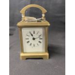 Clocks: 19th cent. Brass carriage clock, white enamel face with Roman numerals, unsigned movement.