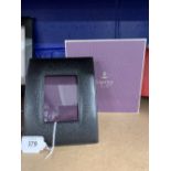 Designer Desk Furniture: Asprey & Company black leather covered free standing photo frame. Curved