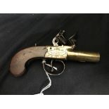 Antique Guns: Flintlock muff/travelling pistol, brass barrel with the sides of the frame embellished