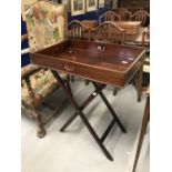 19th cent. Mahogany butler's tray on folding stand.