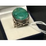 The Lady Lowry Jewellery Collection: Jade jewellery Cabouchon ring set in silver (tested). 13g.