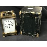 Clocks: French brass 8 day carriage clock with key and carrying case.