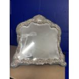 Hallmarked Silver: Framed dressing table mirror with scroll pattern.