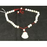 The Lady Lowry Jewellery Collection: White jade jewellery. Thirty matching beads ?ins. Dia. plus