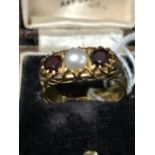 Hallmarked Gold: 22ct. Ring, claw set with two 3.5mm circular cut garnets. Estimate weight of (2)