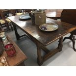 20th cent. Three plank oak refectory table, on turned gun barrel supports with stretchers. 74ins.