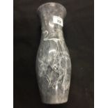 The Thomas E Skidmore Collection: Chinese grey Jade slender vase with engraved decoration