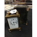 Clocks: French brass 8 day carriage clock with key and carrying case.