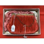 Fashion: Deep pink pleated silk evening bag, self colour, silk lining with purse. The frame is