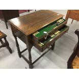 20th cent. Fitted two drawer oak table canteen containing silver plated cutlery with simulated ivory