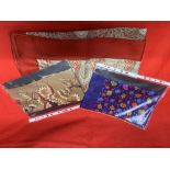 Fashion: Liberty silk scarves. Red ground with peacock style design scarf, printed Liberty London