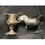 Hallmarked Silver: Embossed creamer, shell pattern & hoof feet, initialed E.W London marks 1743.