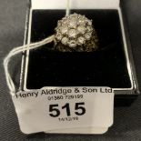 Diamond Jewellery: Ring in the form of a nineteen diamond triple tier floral cluster, estimated