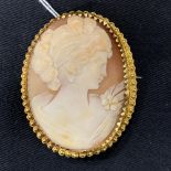 Jewellery: Yellow metal brooch set with an oval cameo. Tests as 18ct. Weight 16.2g. Plus white metal