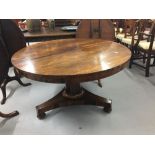 19th cent. Rosewood tilt top table with octagonal supports on tri-pad feet. Dia. 49ins.