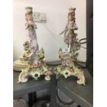 20th cent. Continental style candlesticks in the form of a lady and gentleman on a pedestal
