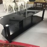 20th cent. Black glass and chrome TV/entertainment unit. 55ins.