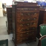 19th cent. Swiss mahogany caddy top chest of seven graduated drawers with brass fittings. 39½ins.