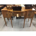 Georgian mahogany bow fronted serpentine sideboard with one central drawer flanked by two cupboards,