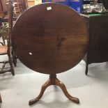 19th cent. Mahogany tilt top table on three splayed supports. The top is cut from a single plank.