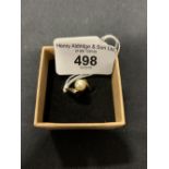 Gold Jewellery: Yellow metal ring in the form of a crossover with a single 7mm cultured pearl at the