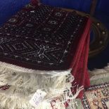 @21st cent. Rug: Bokhara, red ground with stylised geometric designs in reds, blues, ivory and