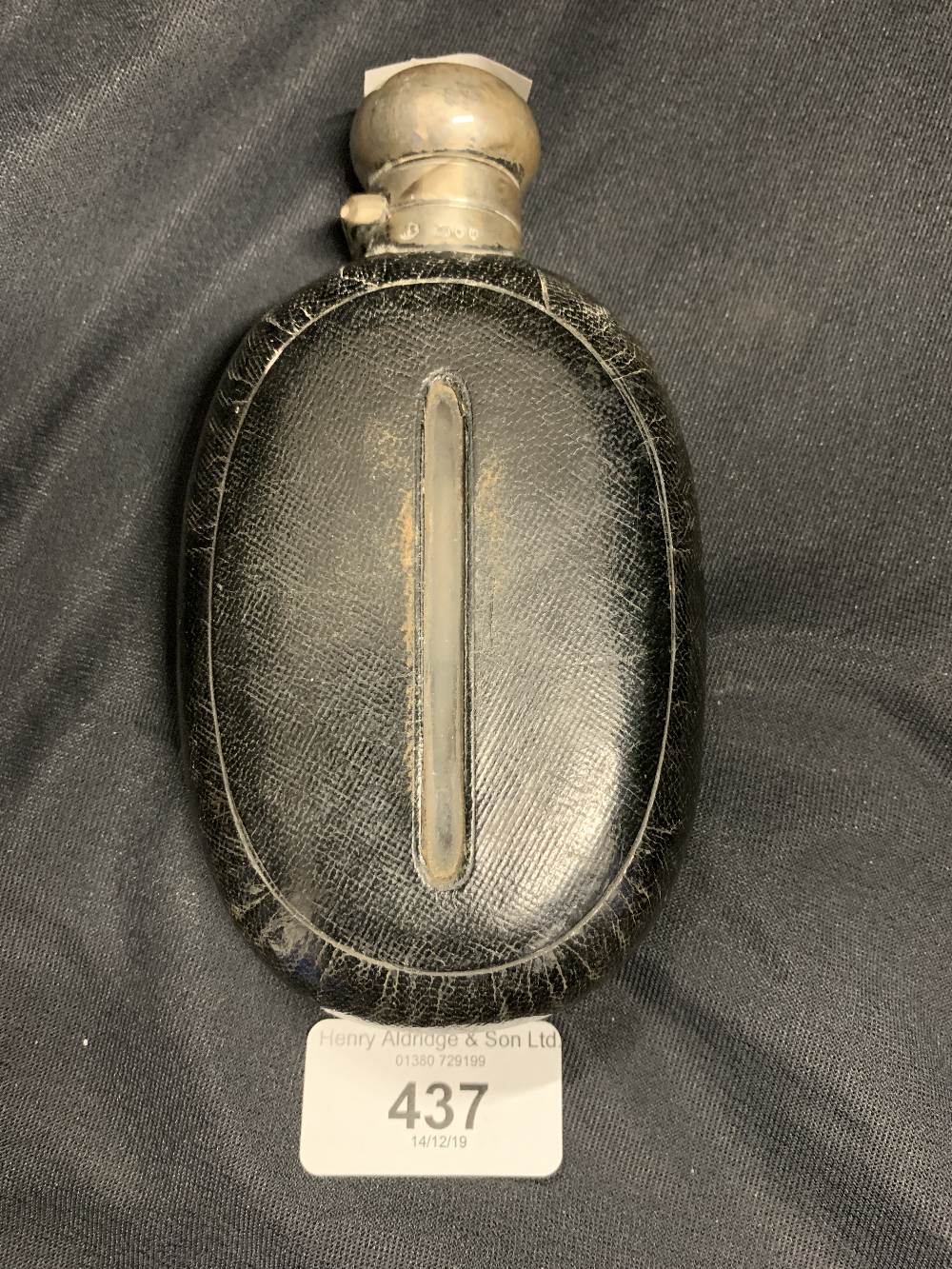 Hallmarked Silver: Leather bound glass hip flask with hallmarked collar.