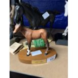 20th cent. Ceramics: Royal Doulton matt black horse on plinth and a Beswick matt brown "Adventure