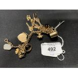 Hallmarked Gold: 9ct. bracelet with thirteen assorted charms attached, various hallmarks. Weight