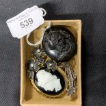 19th cent. Mourning Jewellery: Jet carved locket, black glass cameo, paste floral brooch, crescent