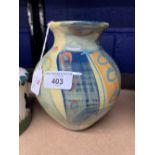 Studio Pottery: Richard Wilson baluster vase with flared rim, decorated in pastel hues. Seal mark to