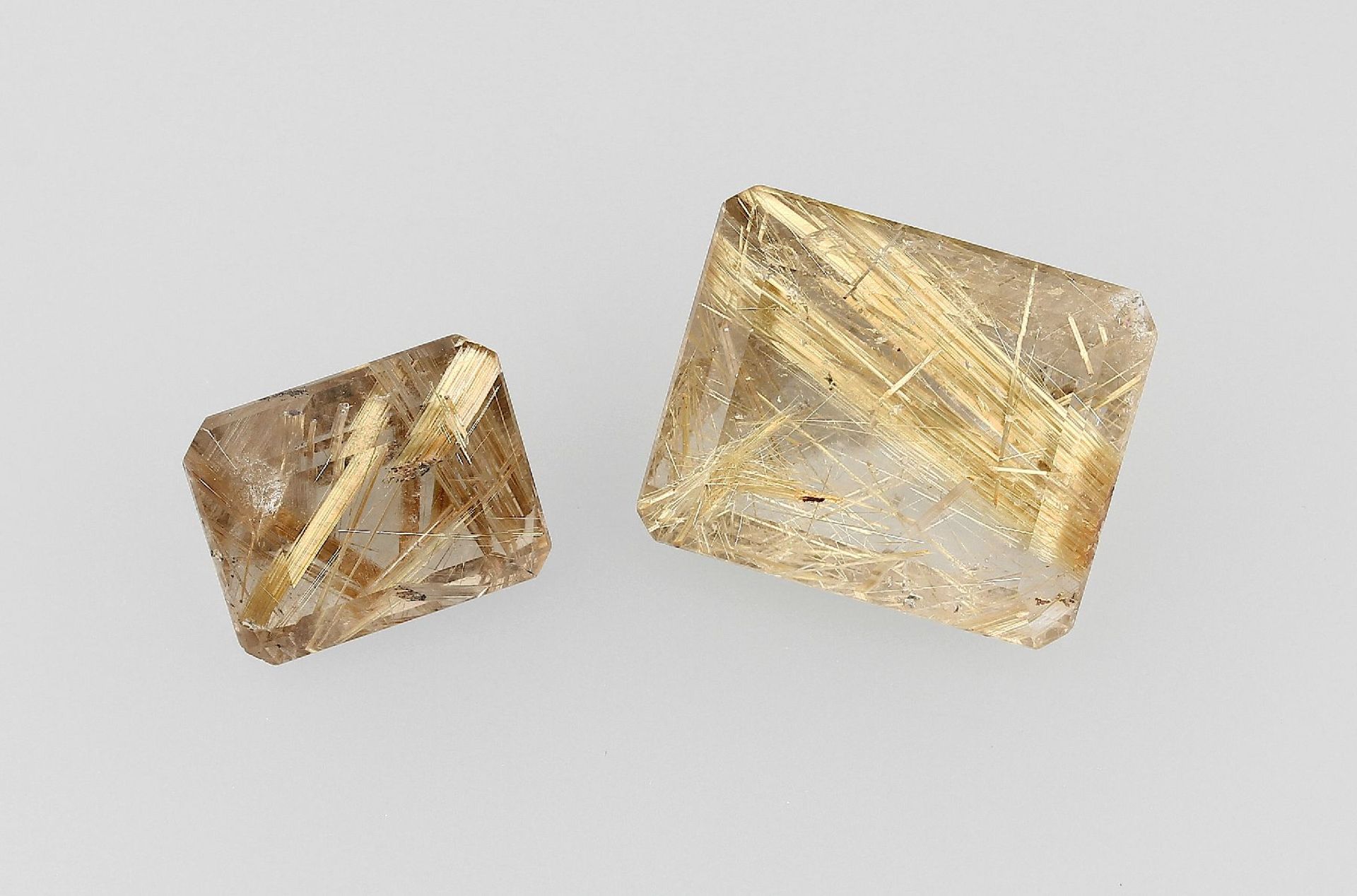 Lot 2 lose Rutilquarze, best. aus: 1 x ca. 22.8 ct, achteckig facett., 1 x ca. 48 ct, achteckig