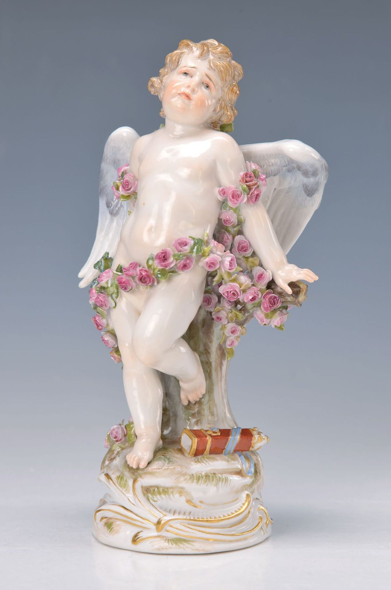 Porzellanfigur, Meissen, 2. H. 20. Jh., Putto mit Blumengirlande, polychrom bemalt, mit applizierten