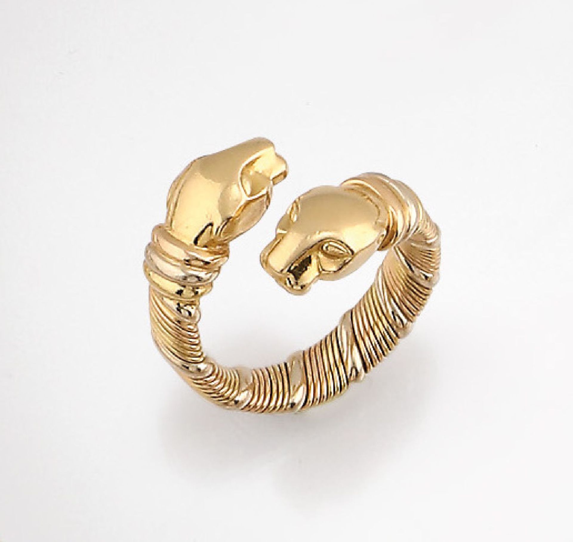 18 kt Gold CARTIER Ring "Panther", GG/WG/RG 750/000, Pantherköpfe, flexibel, sign. und num., RW