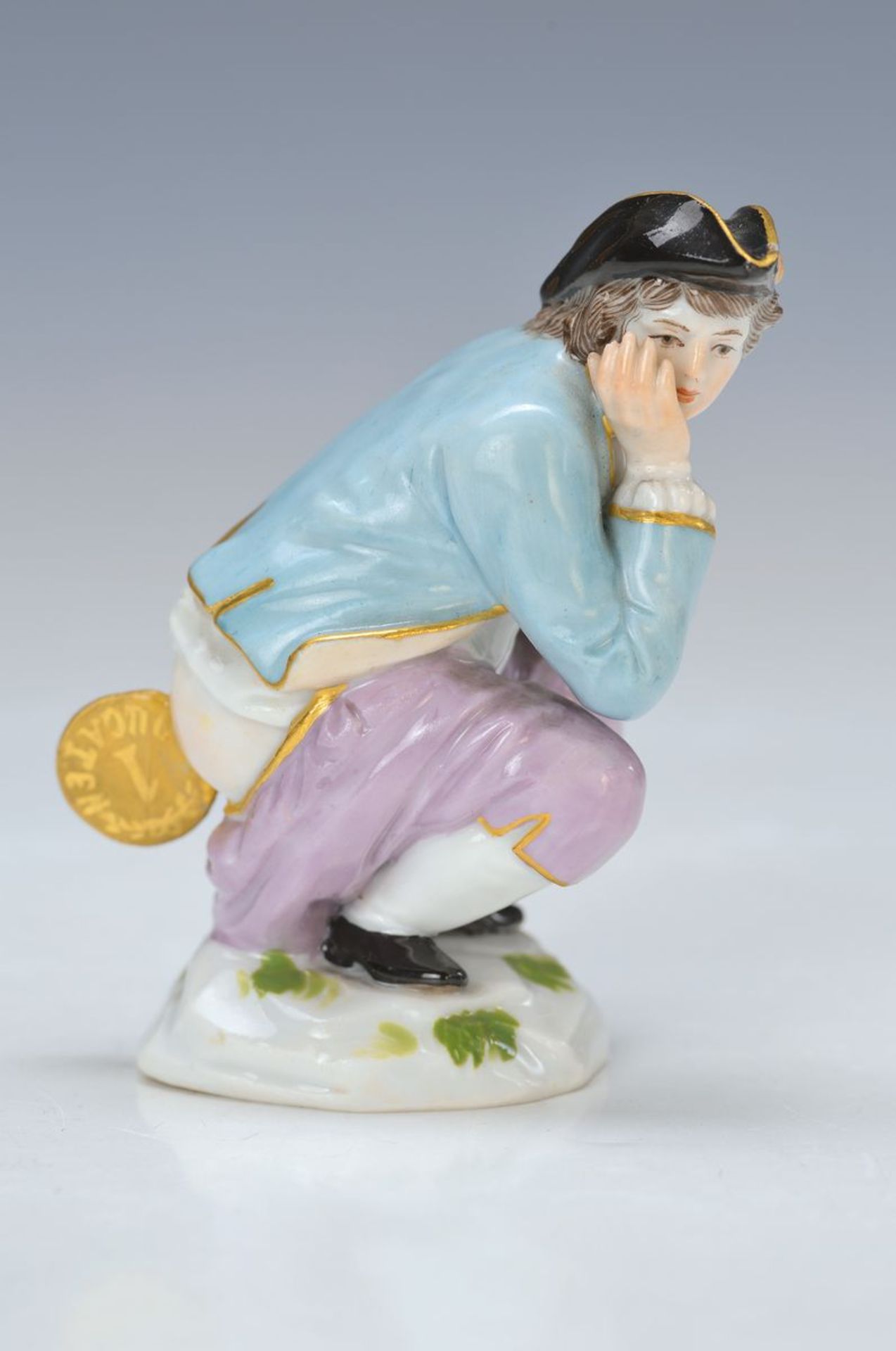 Porzellanfigur, Meissen, um 1890, "Dukatenmacher" oder "Dukatenscheisser" polychrom bemalt, leicht