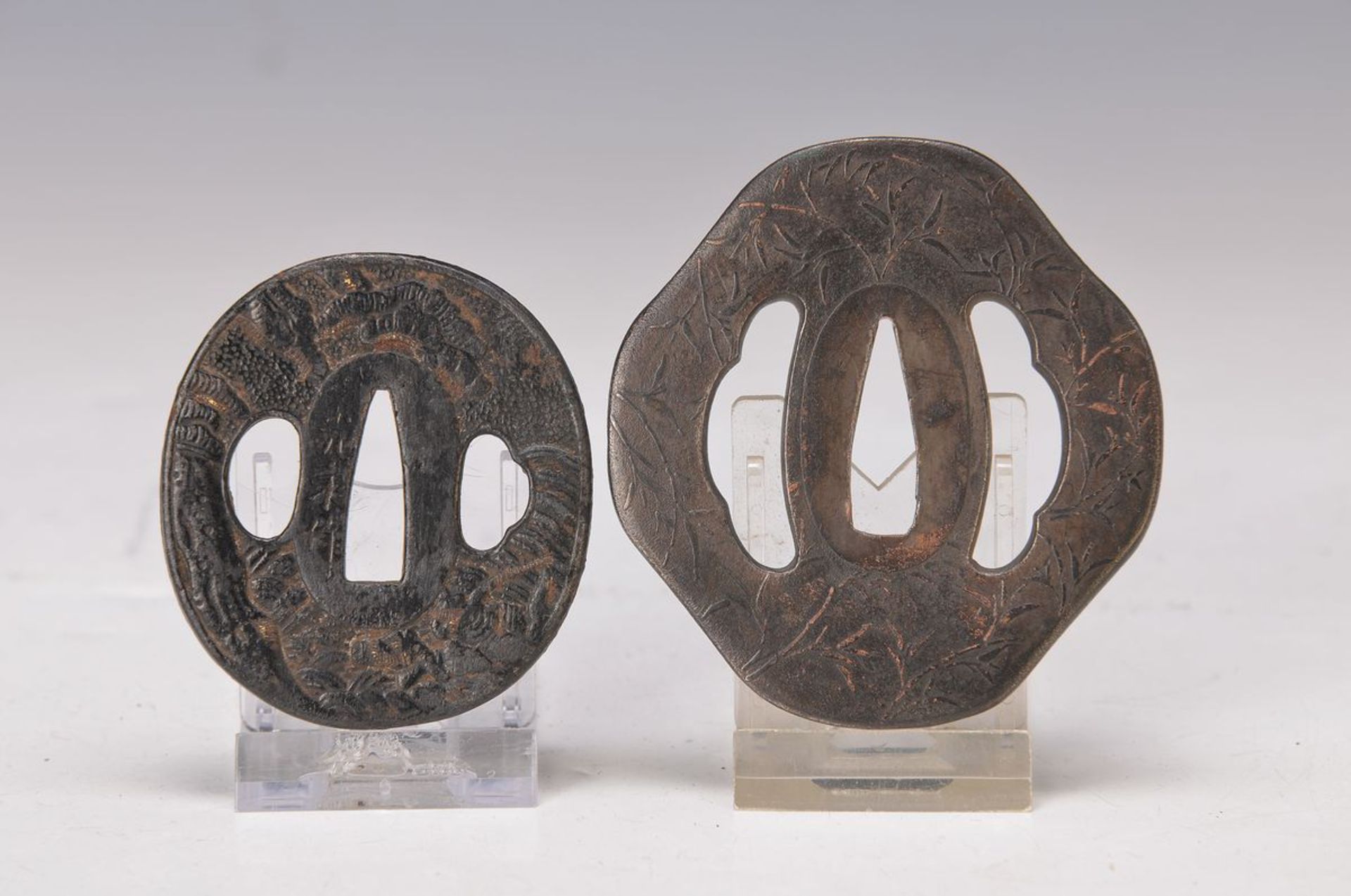 2 Tsubas, Japan, um 1830-40 und um 1860-70, Eisen geschmiedet, geschnitten, 1x mit Bambus Dekor, ca.