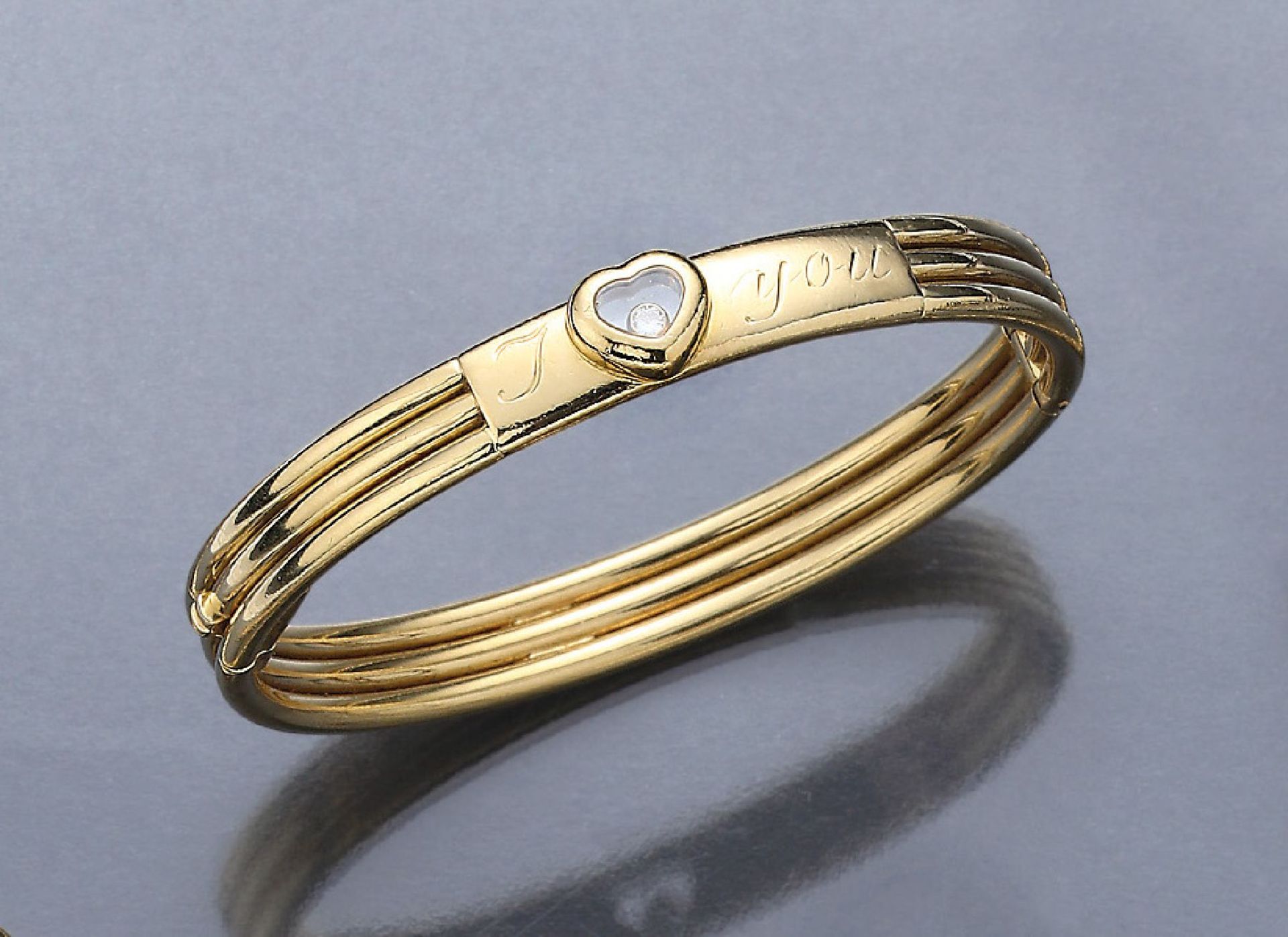 18 kt gold CHOPARD bangle "Happy Diamond" withdiamond , YG 750/000, 1 movable diamond under glass,