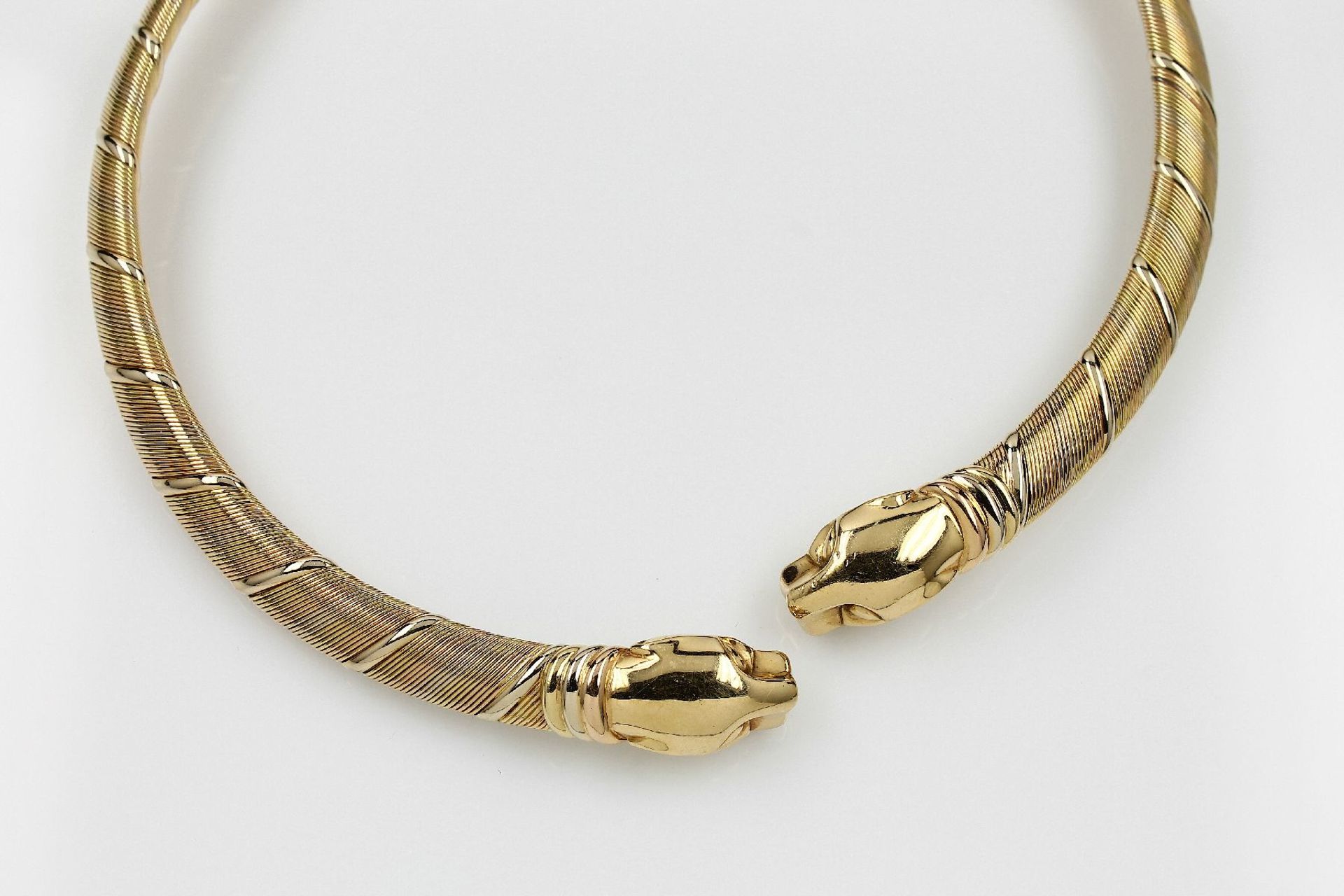 18 kt gold CARTIER circlet , YG/WG/RG 750/000, panther heads, diam. approx. 13 cm, signed and