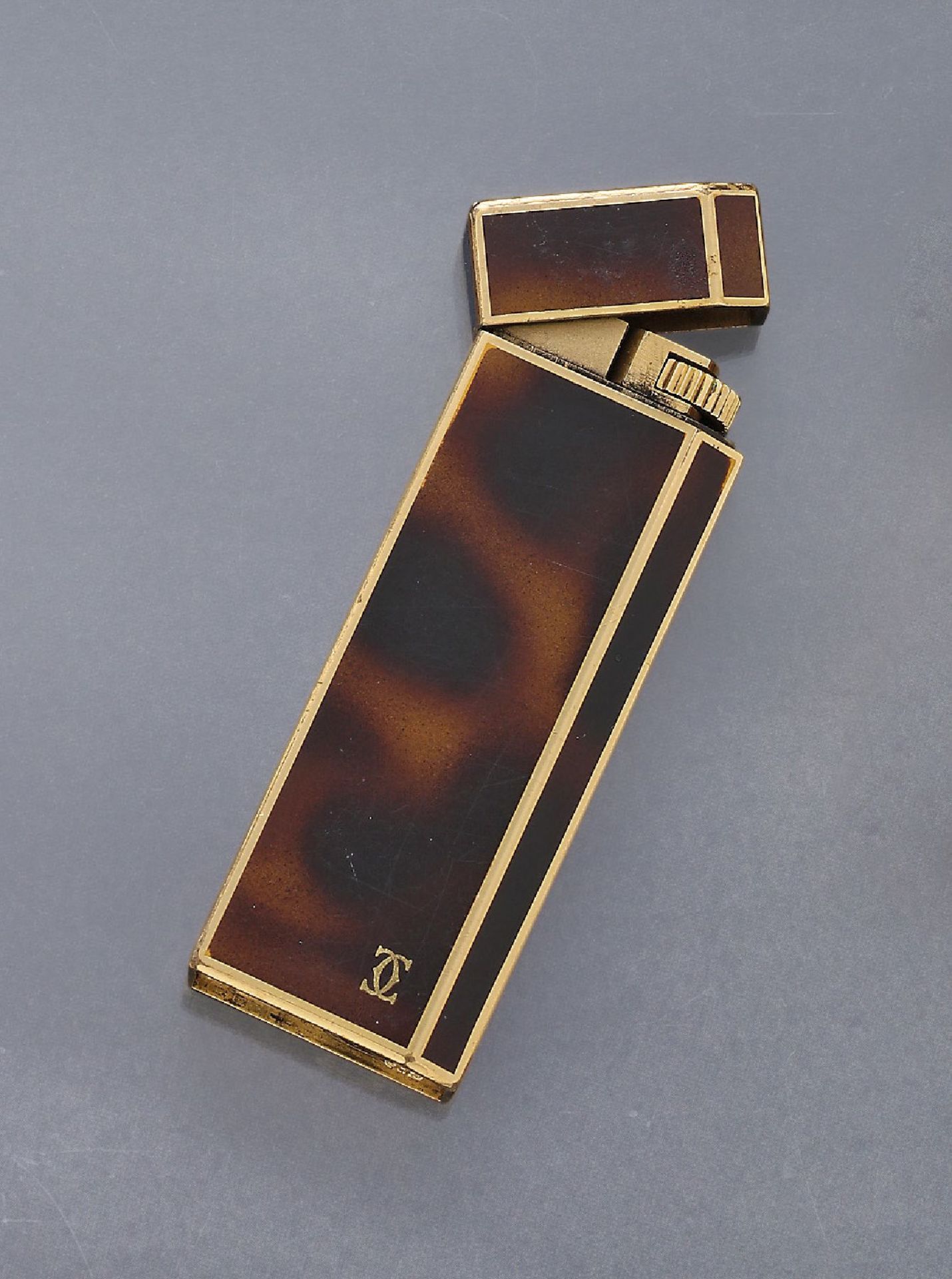 CARTIER lighter with china lacquer , metal gilded, brown china lacquer, signed, signs of usage, in