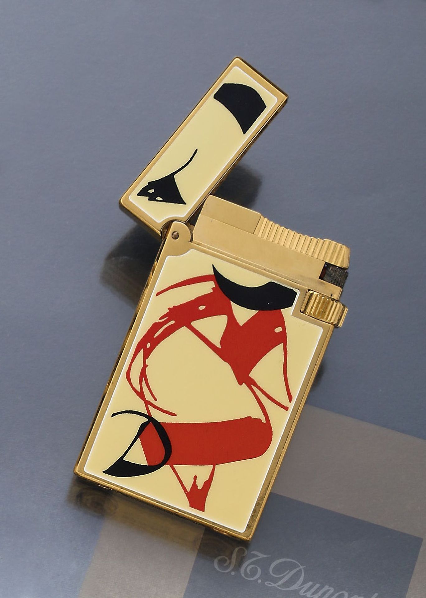 S.T. Dupont lighter "Fantaisies", metal gold plated , china lacquer in ivorycoloured/black/red,