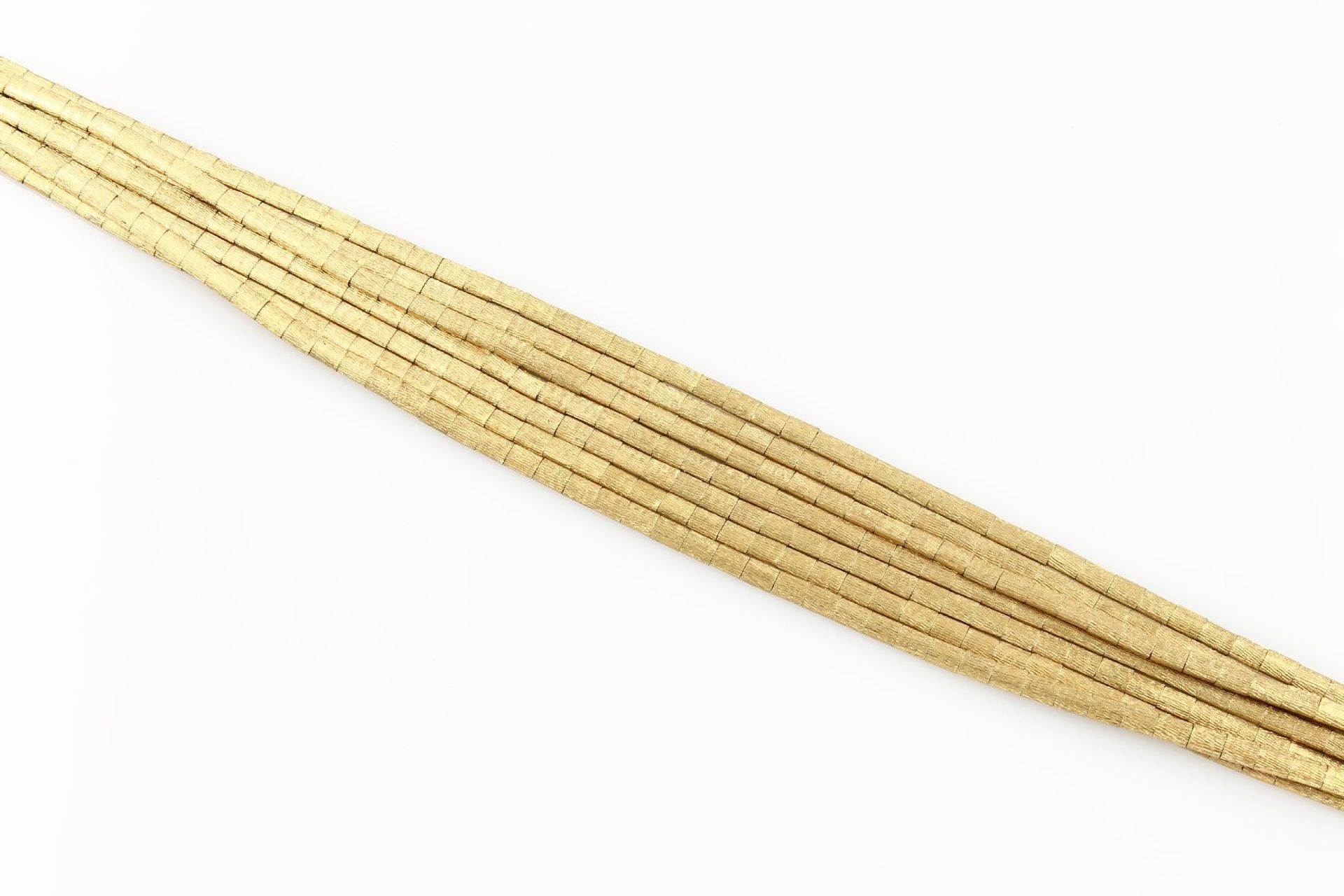 18 kt gold 7-row bracelet , 47.9 g, YG 750/000, brick optic, fine engraved, l. approx. 20 cm, case