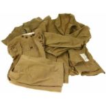 Lot van drie khaki drill trousers, eenmaal 1943 gedateerd en jasje zonder knopen, ook 1943 gedateerd