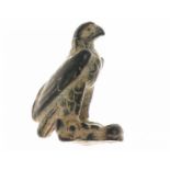 An attractive bronze Roman statuette of an eagle, standing, head left, on prey (ca. 4 cm.)