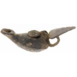 A bronze Byzantine oil lamp, ca. 5th to 7th century AD, with protruding spout and decorated