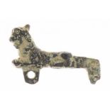 A bronze ancient small statuette/fibula in the shape of a panter (ca. 5 cm.)