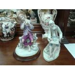 TWO SPANISH PORCELAIN STYLE FIGURES
