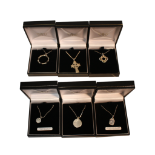 COLLECTION OF SIX ASSORTED PENDANTS ON CHAINS